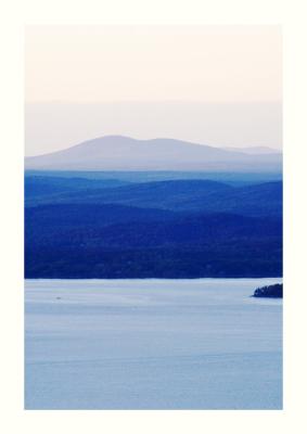 At this time of day, layer of hills, mountains and water are accentuated in the distance.