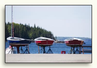 Small sailboats waiting to be launched in Castine and....