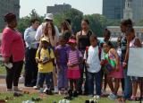 Children Looking At the Civilian Shoes