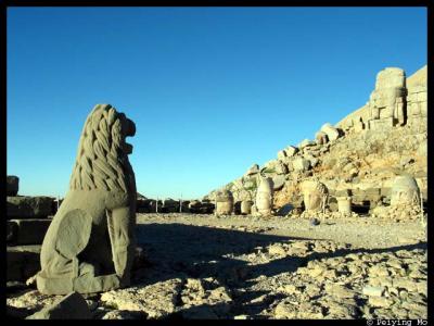 Lion facing the stone heads