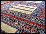Prayer rug runs from wall to wall