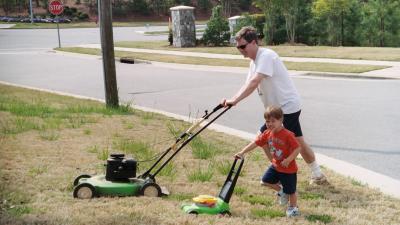 Ben helping Papa cut the grass