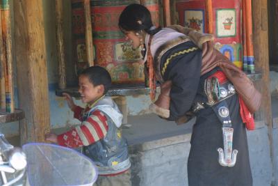 Tibetan Pilgrims at Prayer Wheels - Labrang Monastery