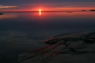 July 9: Sunset in a still sea