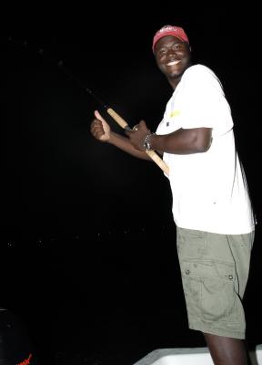 anthony fighting 65lb tarpon 06-20-04.jpg