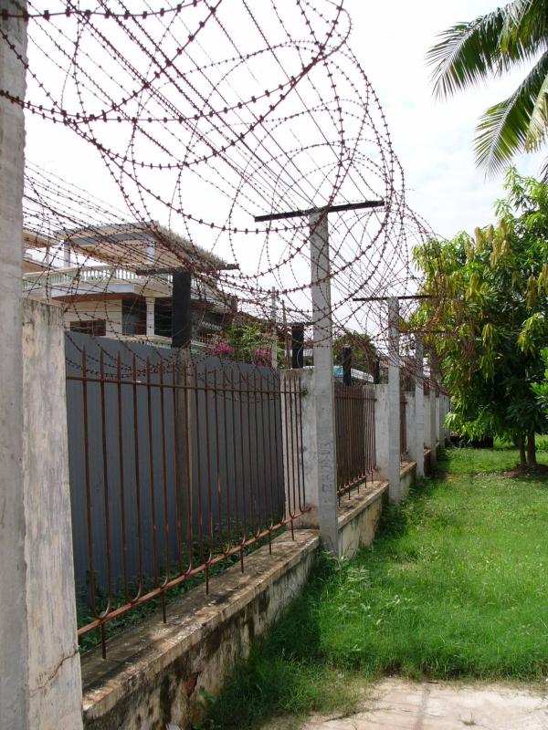 Double fence & barbed wire still there