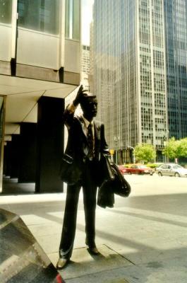 Statue of man who hail Yellow cab