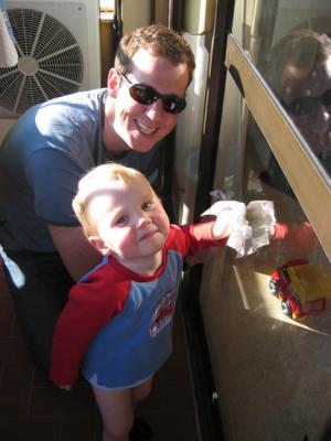 Luis and Ralph cleaning the windows after just arriving back in Seville