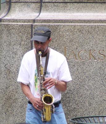 A wailing saxophone street performer