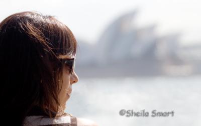 Girl on ferry with Opera House backdrop