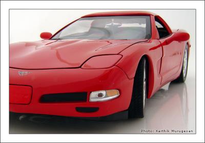 A Wide red Corvette*  by Karthik