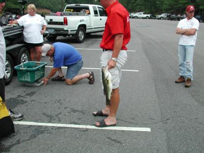 Mountain Home Champ Weighing Fish