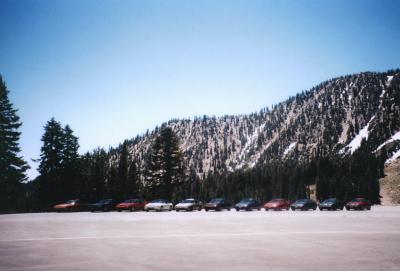 cars in front of mountain