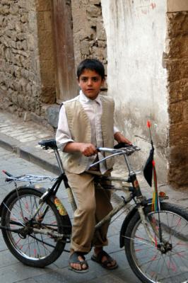 Boy pausing on a bike