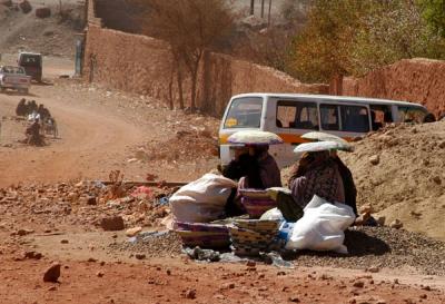 Woman with baskets selling at Wadi Dhahr