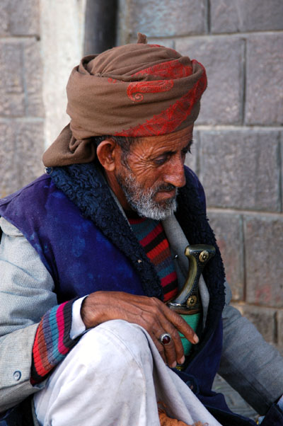 Old man having a Jambiya repaired, Sana'a, Yemen