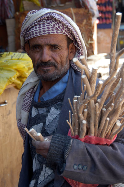 Man selling miswak, a chewing stick