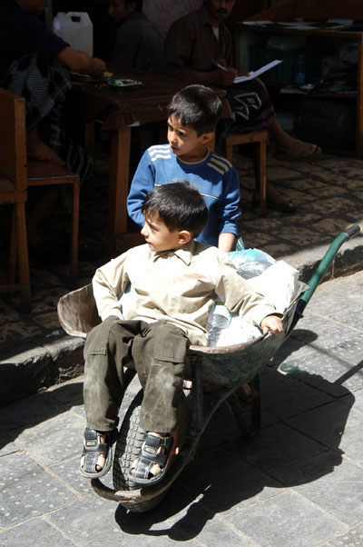 Boys with a wheelbarrel