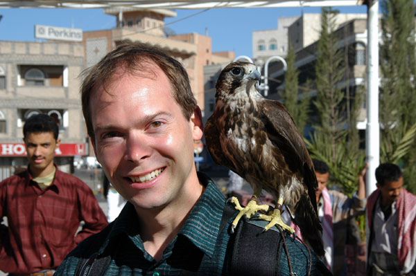 Roy with a small falcon, Tahrir Square