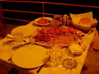 A yellow-lit dinner with Skyros traditional food...
