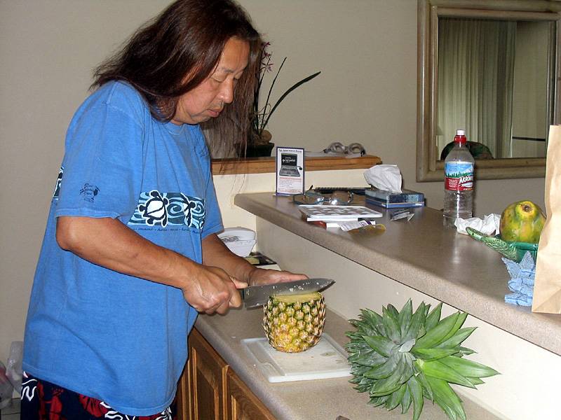 I'm cutting a pineapple