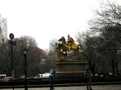 The fog sets in on gold gilded statue at Plaza Hotel