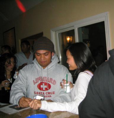 frank and ines signing pang's card