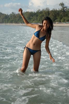 Thai girl enjoying the sea