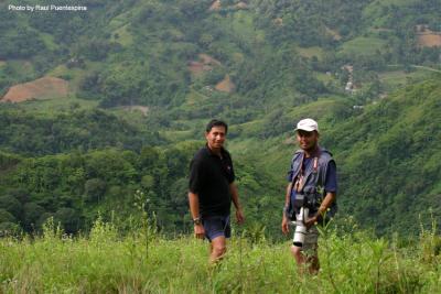 Batman and Robin (Nilo Arribas and me) pose for posterity with the verdant Maraag valley (Cebu) in the background.
