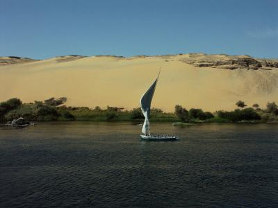 Sailing on the Nile by the desert
