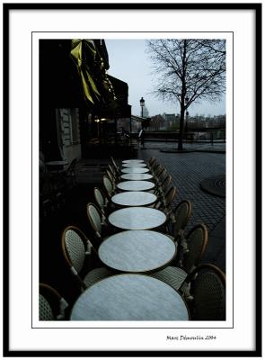 Line of marble tables in the cold morning
