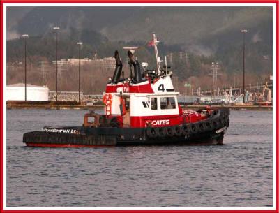 Cates tug helping to dock a ship.