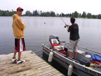 Jimmy & Ryan Fish From the Docked Boat.