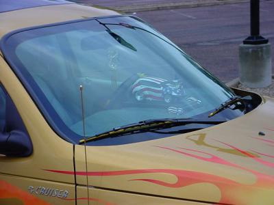 red white and blue  PT Cruiser in the window