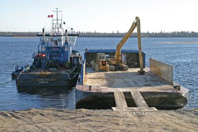 Aft view of Hudson Bay Explorer beside barge