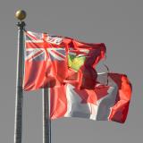 Ontario flag and Canadian flag in front of Ontario Government Building, Moosonee