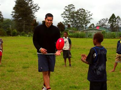 Mel Michael from Essendon (Aussie Rules football) giving a footy lesson