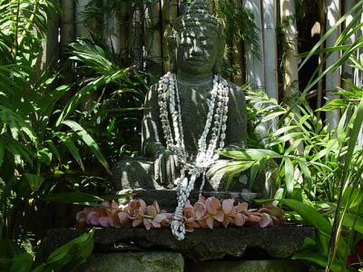 Balinese buddha inside a wooden shrine