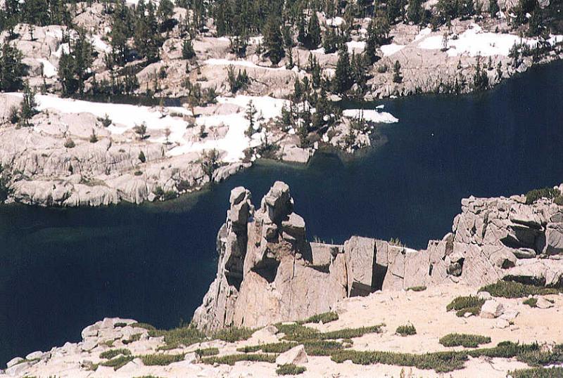 Close-up of Tower Above Blue Lake