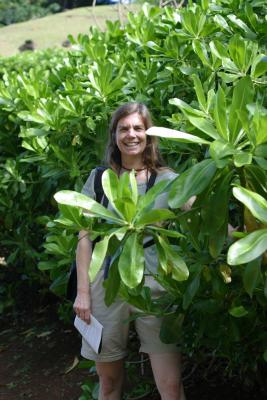 Cynthia playing in the bushes