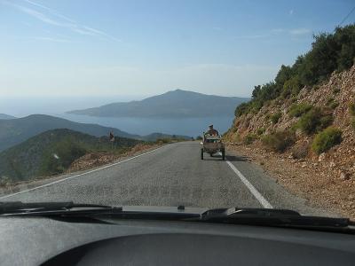 A local on motorcycle pulling cart tries to lead us to Bezirgan.