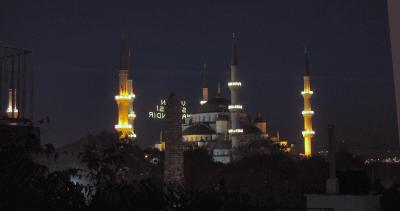 Blue Mosque at night from the hotel rooftop, Column of Constantine in front.