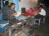 Street grillers, with Turkeys rich tomatos (and peppers?)