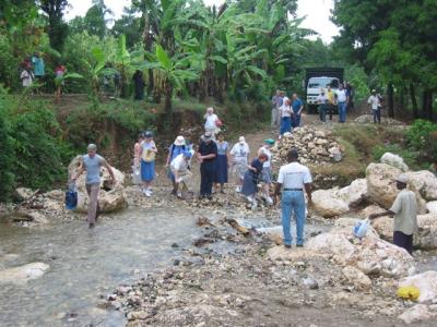 all team members to cross the creek and walk rest of the way to the church