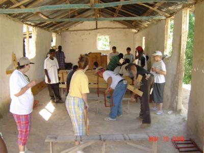 inside an old building (used as a school and church) building benches