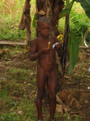 local Hatian boy brushing his teeth