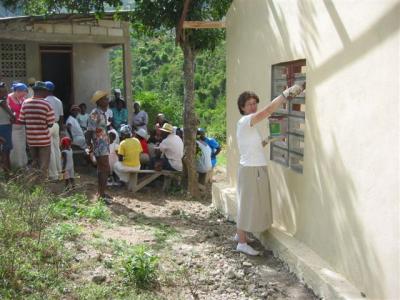 Martha doing some painting and clinic in the back