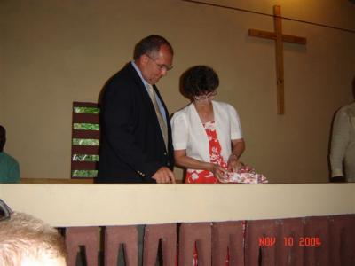 Bill and Martha accepting a gift