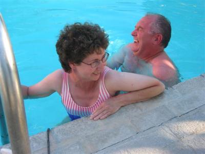 Bill helping Martha get in the pool