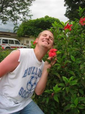 David acting silly posing with a flower